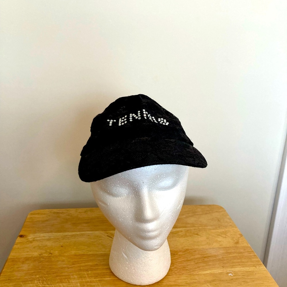 Lacey black lace pattern hat with rhinestone tennis. Adjustable.